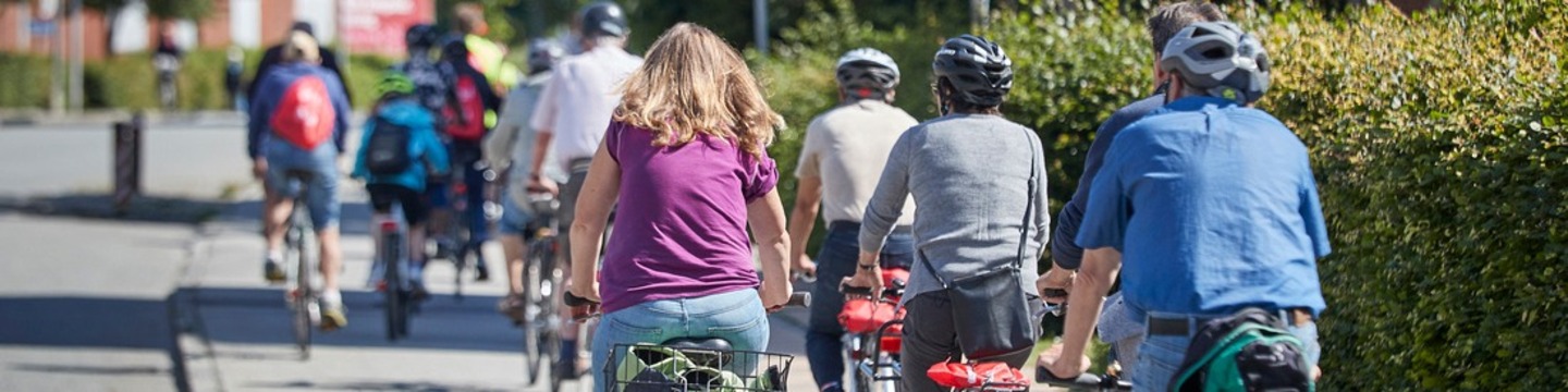 Billede af folk på cykler